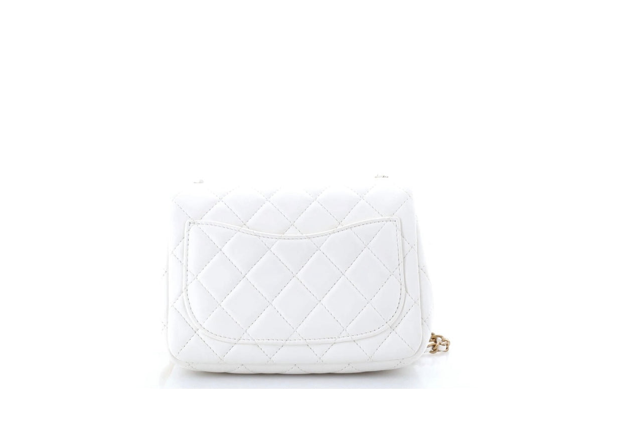 CHANEL
Lambskin Quilted CC Pearl Crush Mini Flap White