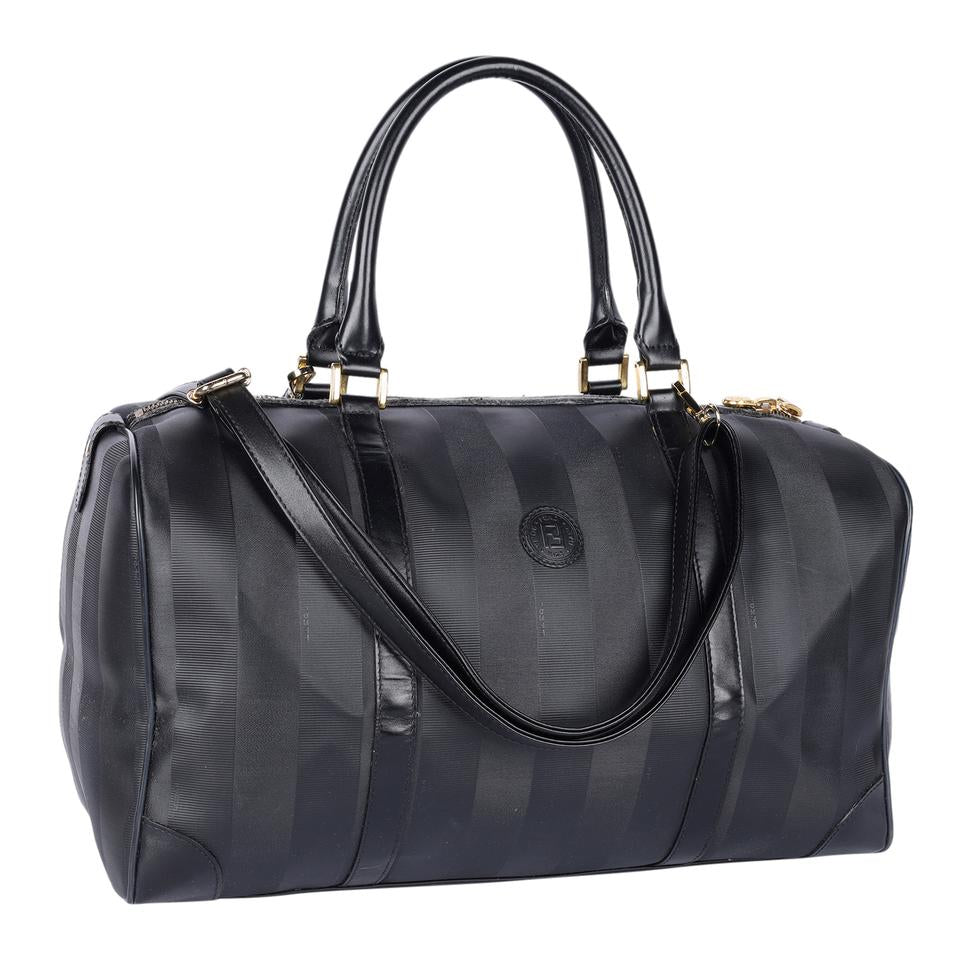 Authentic, pre-loved Fendi 2way duffle black travel handbag with strap. Features inside zipper pocket and black canvas and leather with stripes.
FAA approved for all airlines as a carry-on.
Shoulder drop: 34" - adjustable Made in France - 21"L x 9"W x 11"