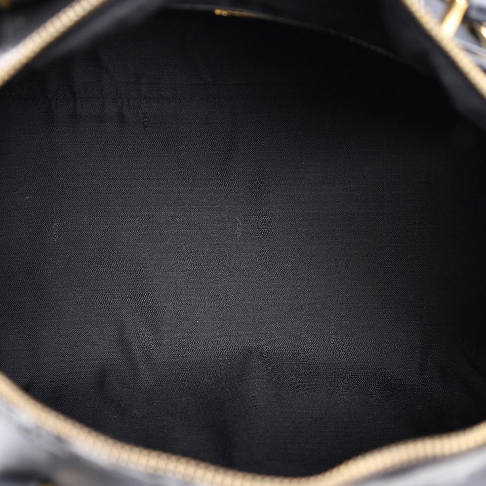 Authentic, pre-loved Fendi 2way duffle black travel handbag with strap. Features inside zipper pocket and black canvas and leather with stripes.
FAA approved for all airlines as a carry-on.
Shoulder drop: 34" - adjustable Made in France - 21"L x 9"W x 11"