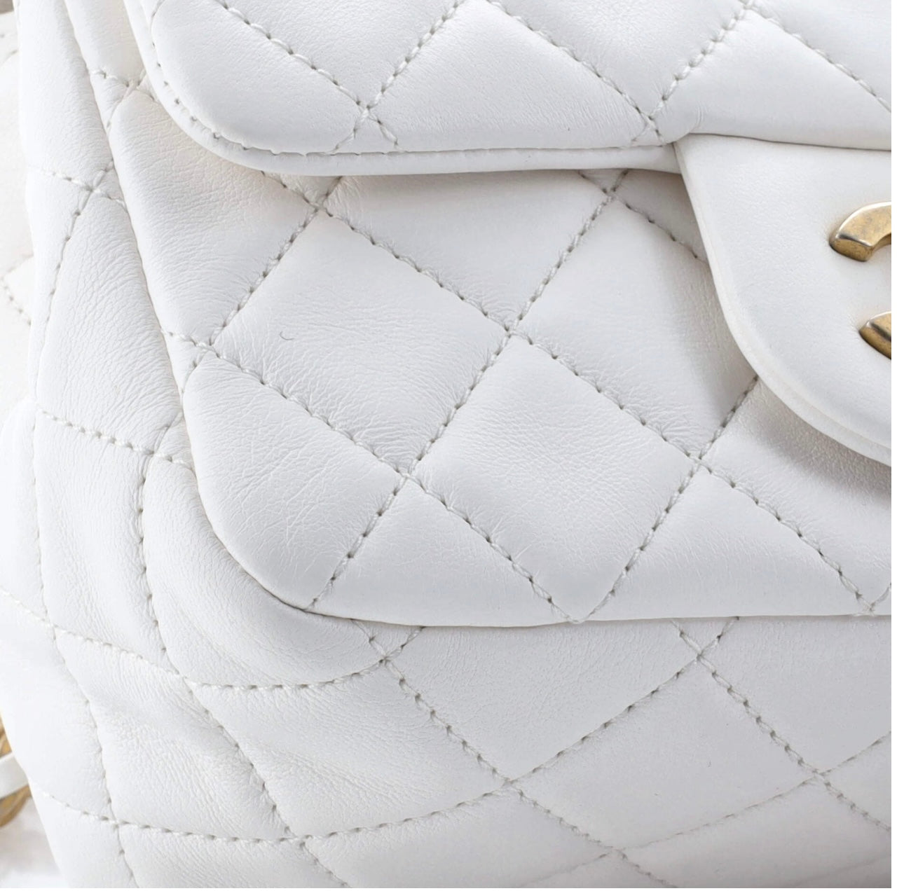 CHANEL
Lambskin Quilted CC Pearl Crush Mini Flap White