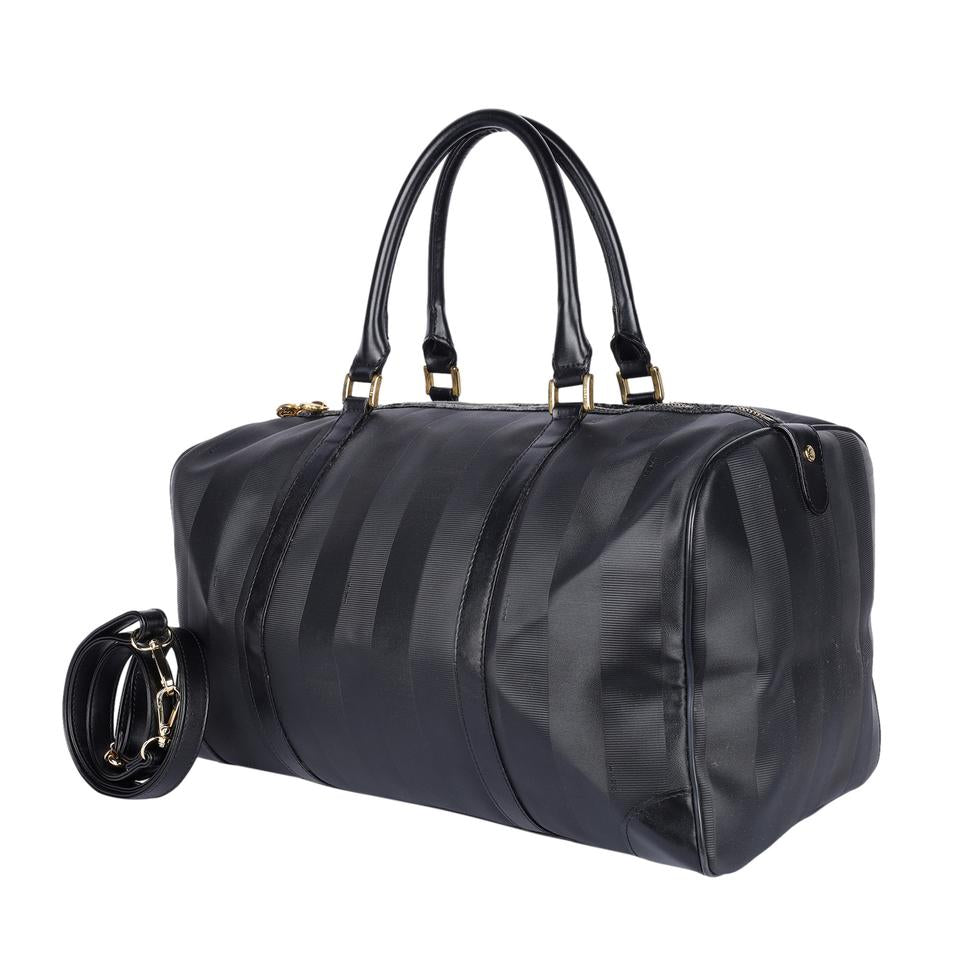 Authentic, pre-loved Fendi 2way duffle black travel handbag with strap. Features inside zipper pocket and black canvas and leather with stripes.
FAA approved for all airlines as a carry-on.
Shoulder drop: 34" - adjustable Made in France - 21"L x 9"W x 11"