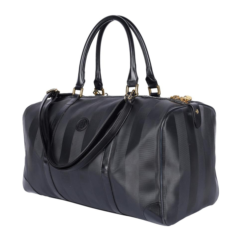Authentic, pre-loved Fendi 2way duffle black travel handbag with strap. Features inside zipper pocket and black canvas and leather with stripes.
FAA approved for all airlines as a carry-on.
Shoulder drop: 34" - adjustable Made in France - 21"L x 9"W x 11"