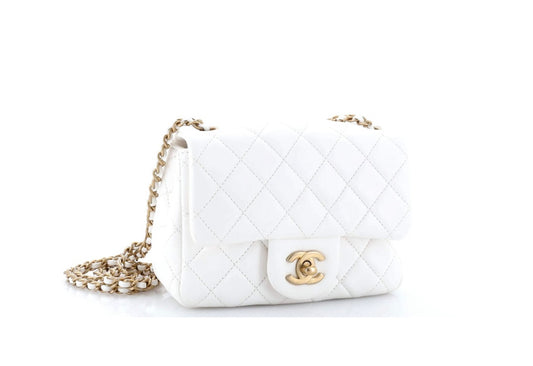 CHANEL
Lambskin Quilted CC Pearl Crush Mini Flap White
