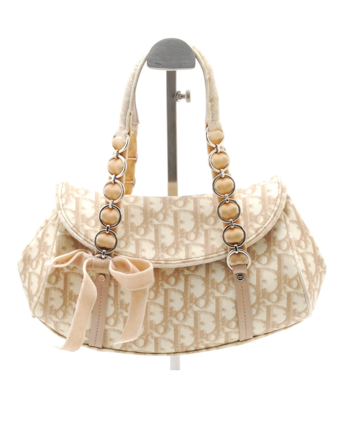 Christian Dior Vintage Trotter Romantique Flap Bag in beige Diorissimo coated canvas with natural leather trim and a velvet bow accent